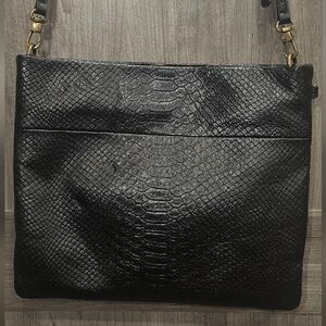 The Sak Tomboy Black Leather Crossbody Bag with an Exotic Print